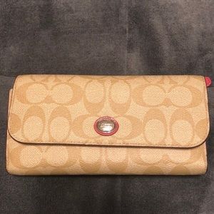 Coach wallet in khaki and pink.